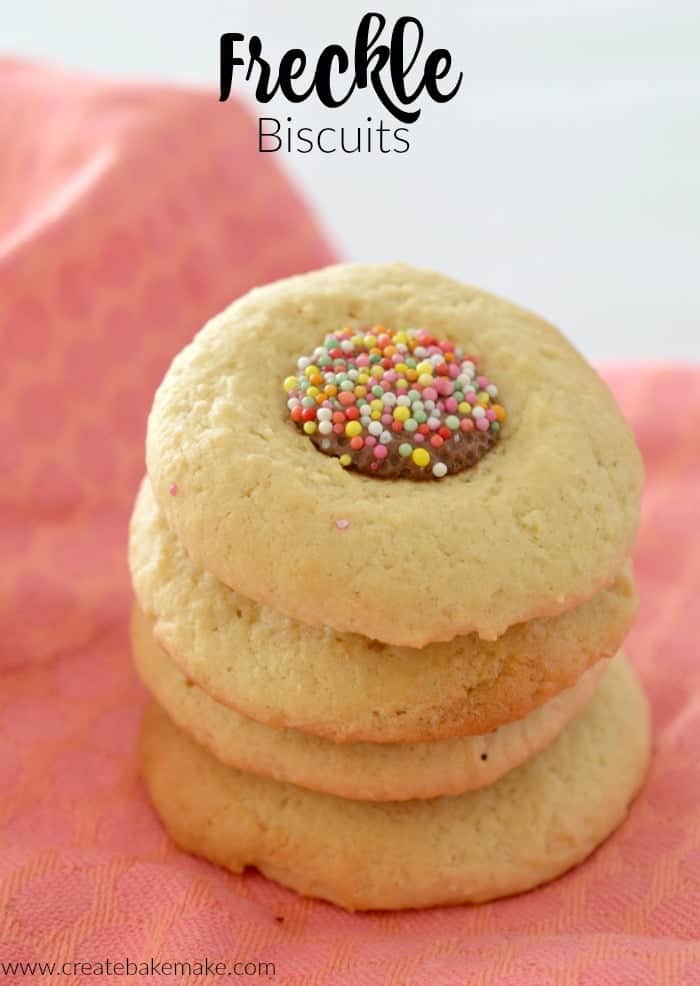 Stack of freckle biscuits on a pink backrground