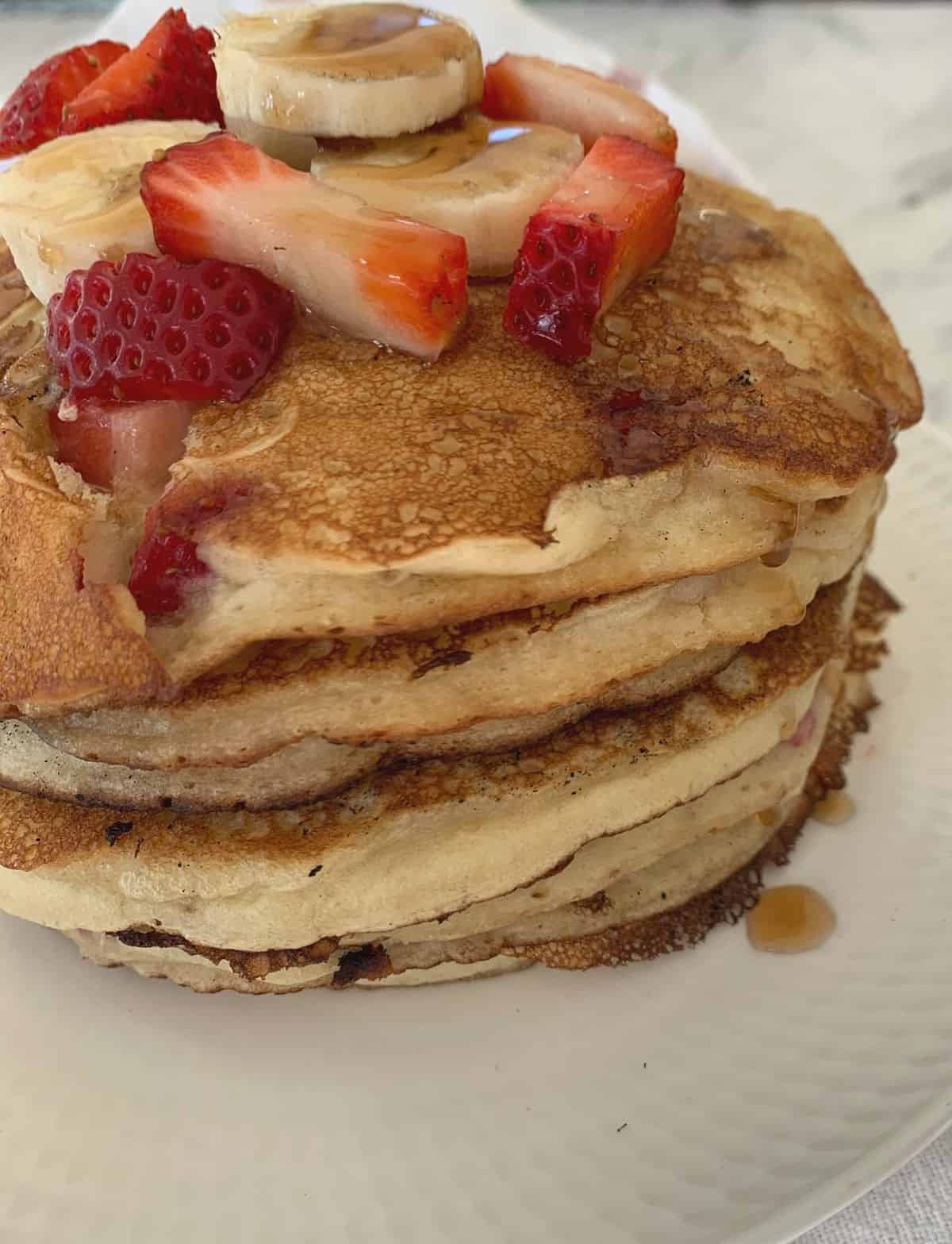 Stack of Strawberry and Banana Pancakes side view