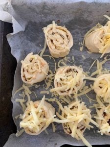 Cheese on top of vegemite and cheese scrolls