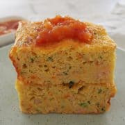 Side view of zucchini slice on a green plate