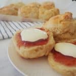 Lemonade Scones on a plate with strawberry jam and cream