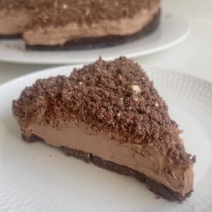 Slice of Toblerone Cheesecake on a white plate.