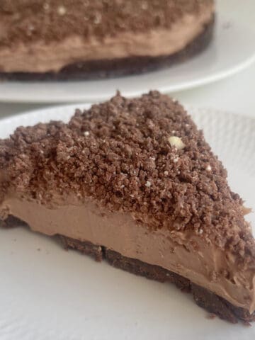 Slice of Toblerone Cheesecake on a white plate.