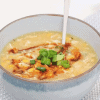 Chicken and Corn Soup in a white serving bowl