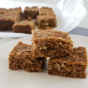 three pieces of anzac slice stacked on top of each other.