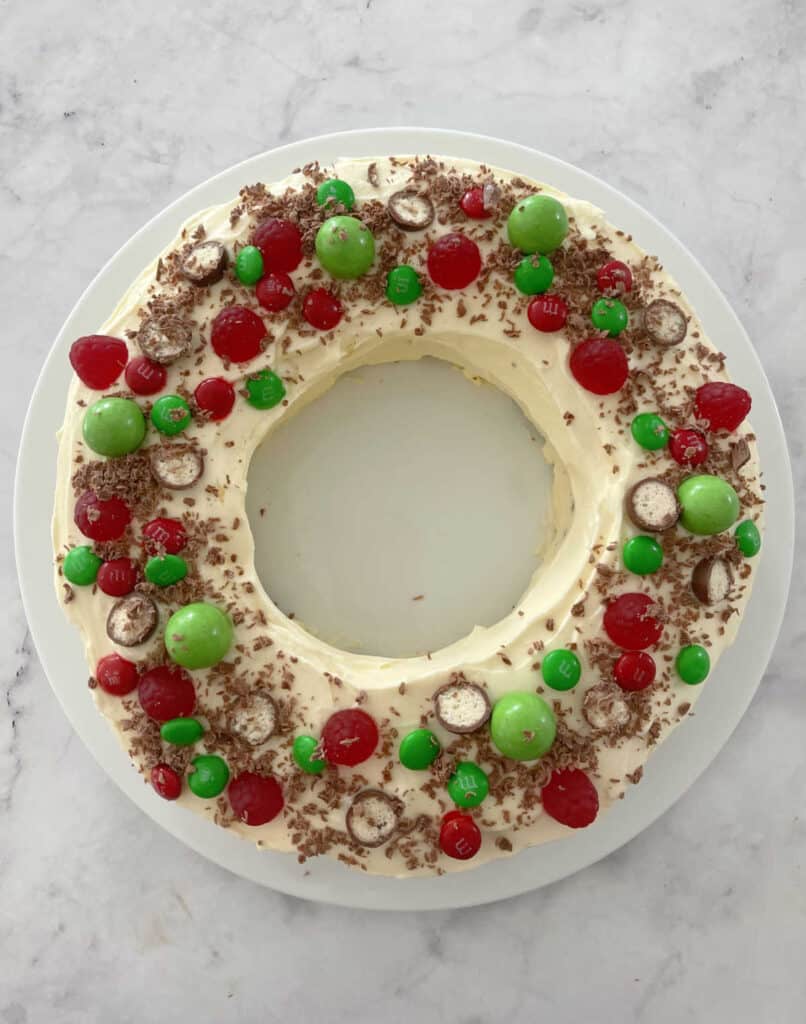 Christmas Wreath Chocolate Ripple Cake on a white plate and marble bench top