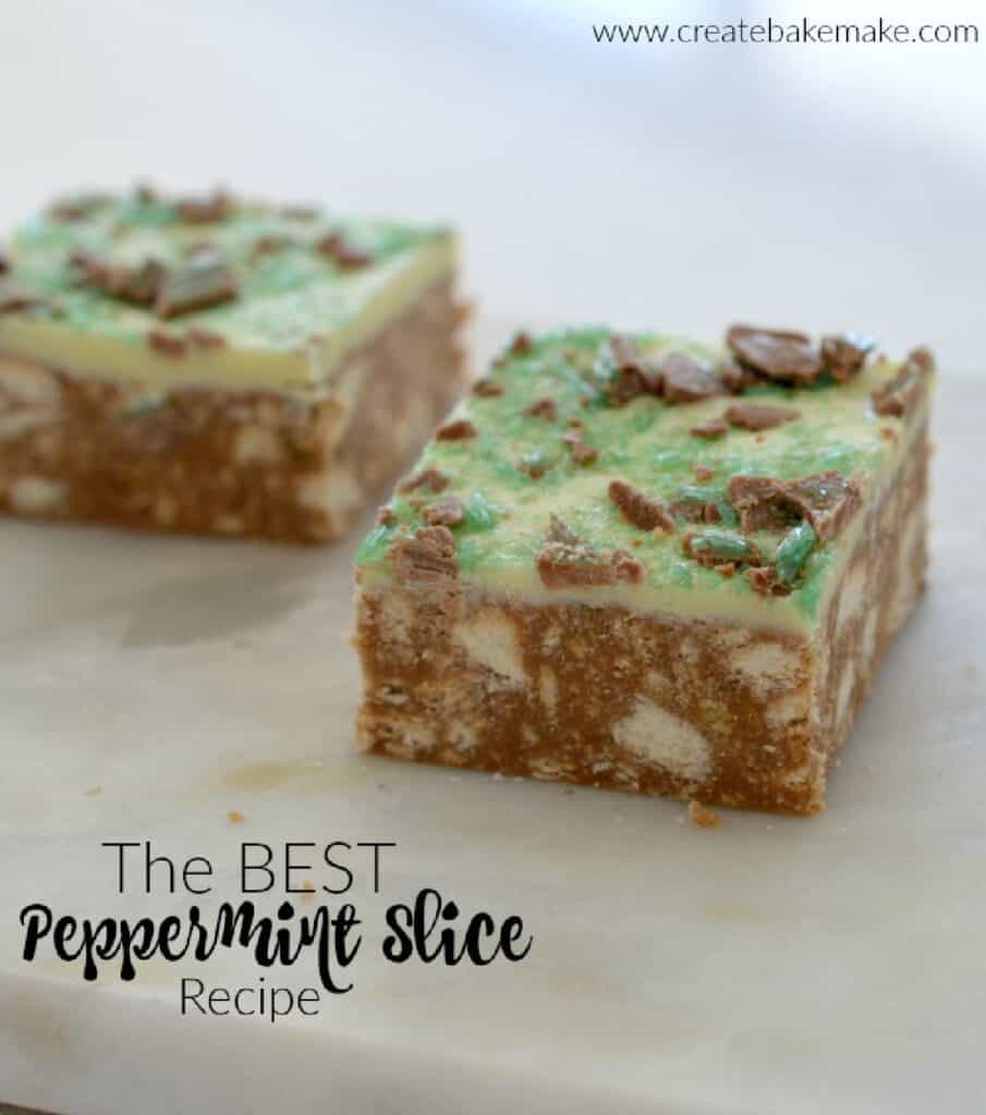 Side view of two pieces of no bake peppermint slice on a marble tray