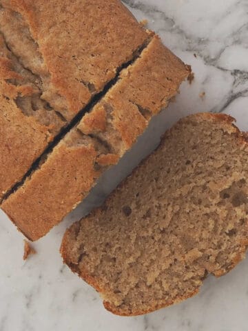 The Best Banana Bread on a marble background.