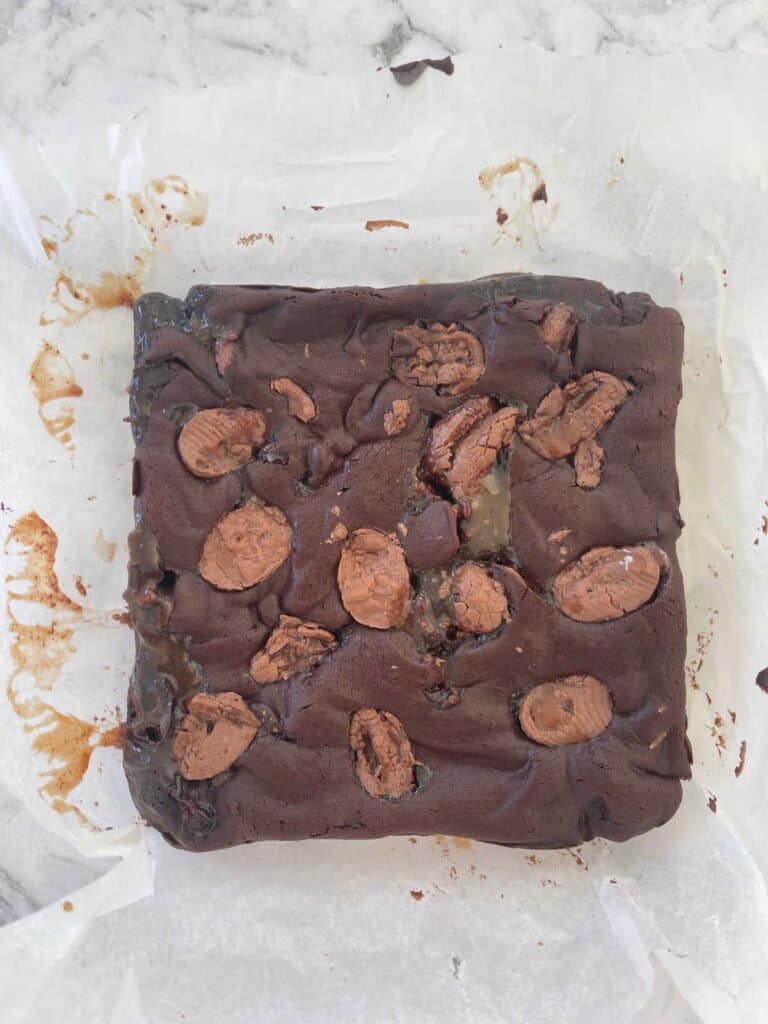 Overhead view of Easter Egg Brownie sitting on a piece of baking paper.