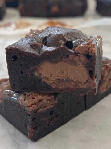 Three pieces of Easter Egg Brownies stacked on top of each other.