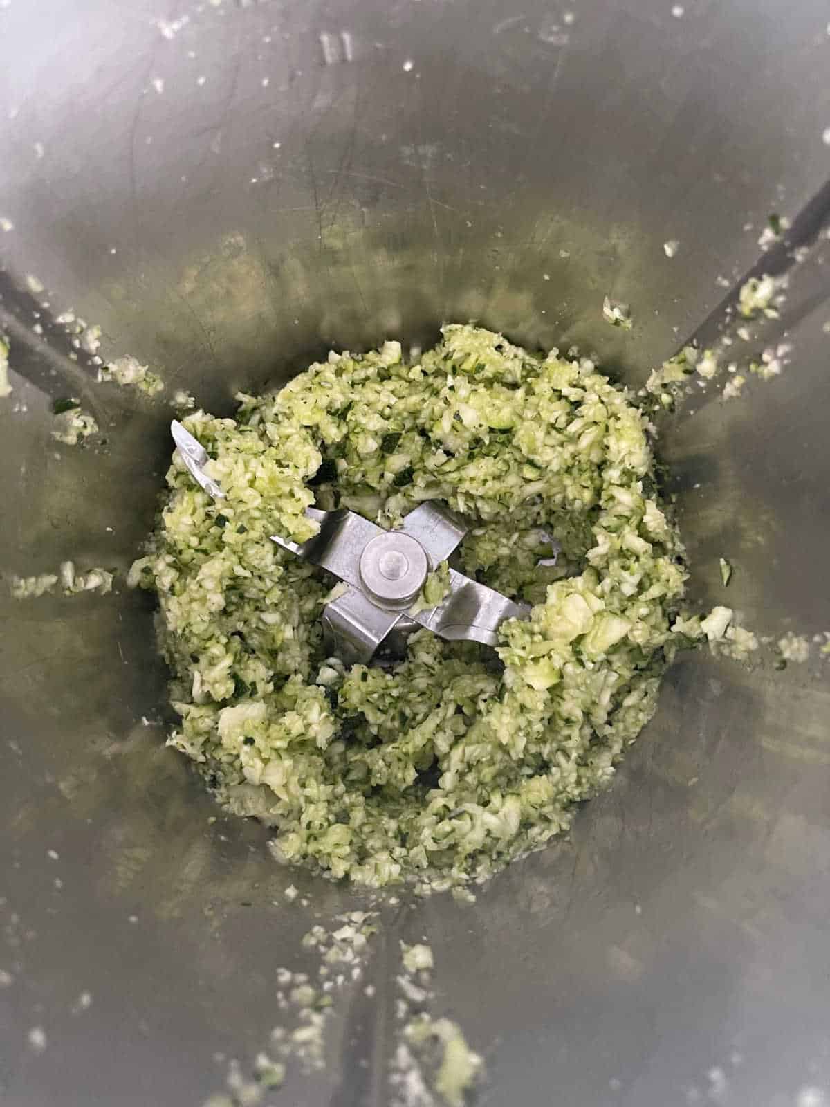 grated zucchini in thermomix bowl.