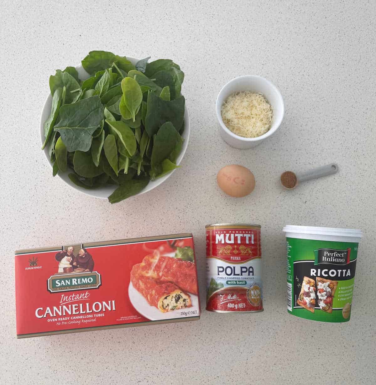 Ingredients to make spinach and ricotta cannelloni.