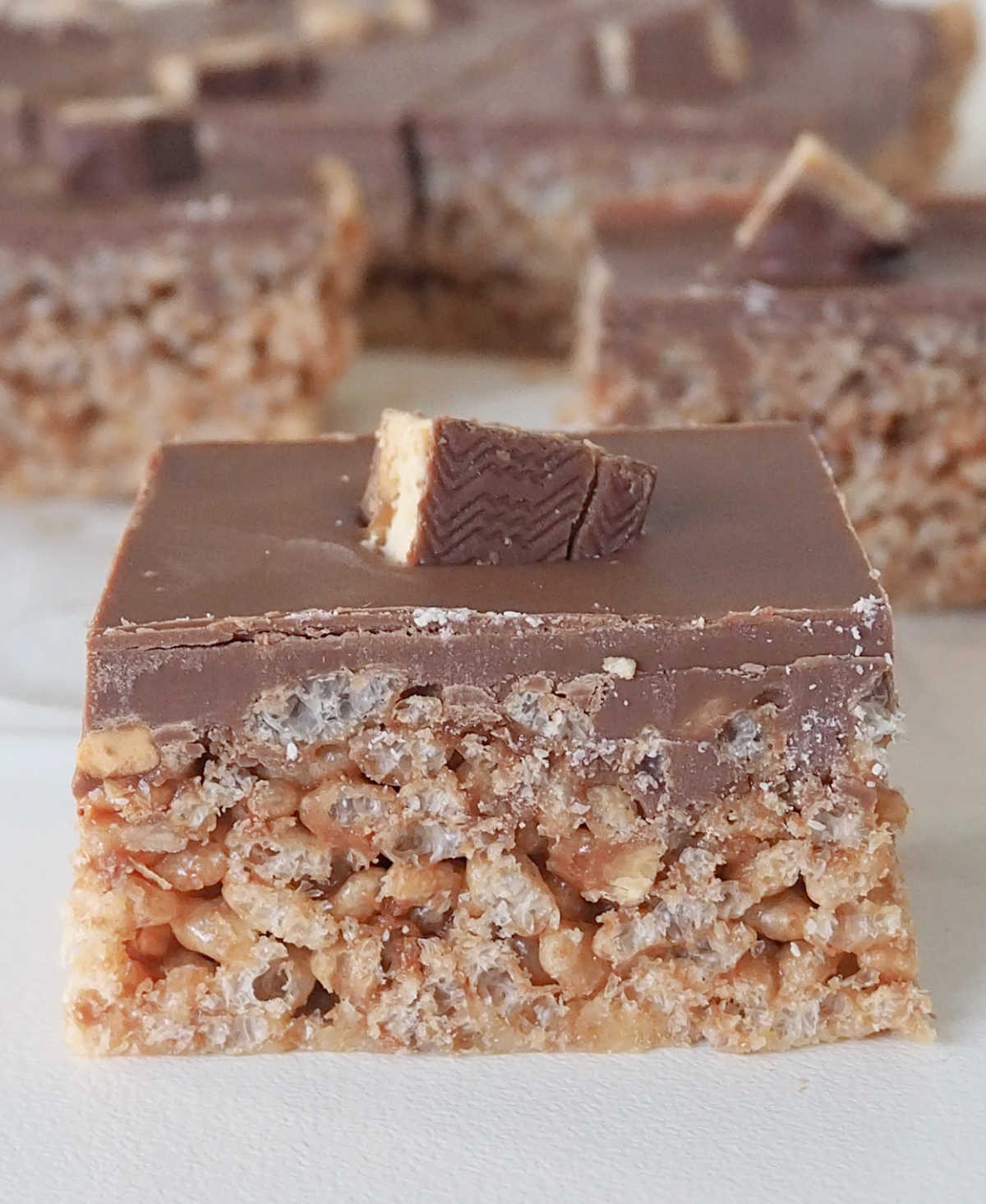 side view of a piece of No Bake Snickers Slice.