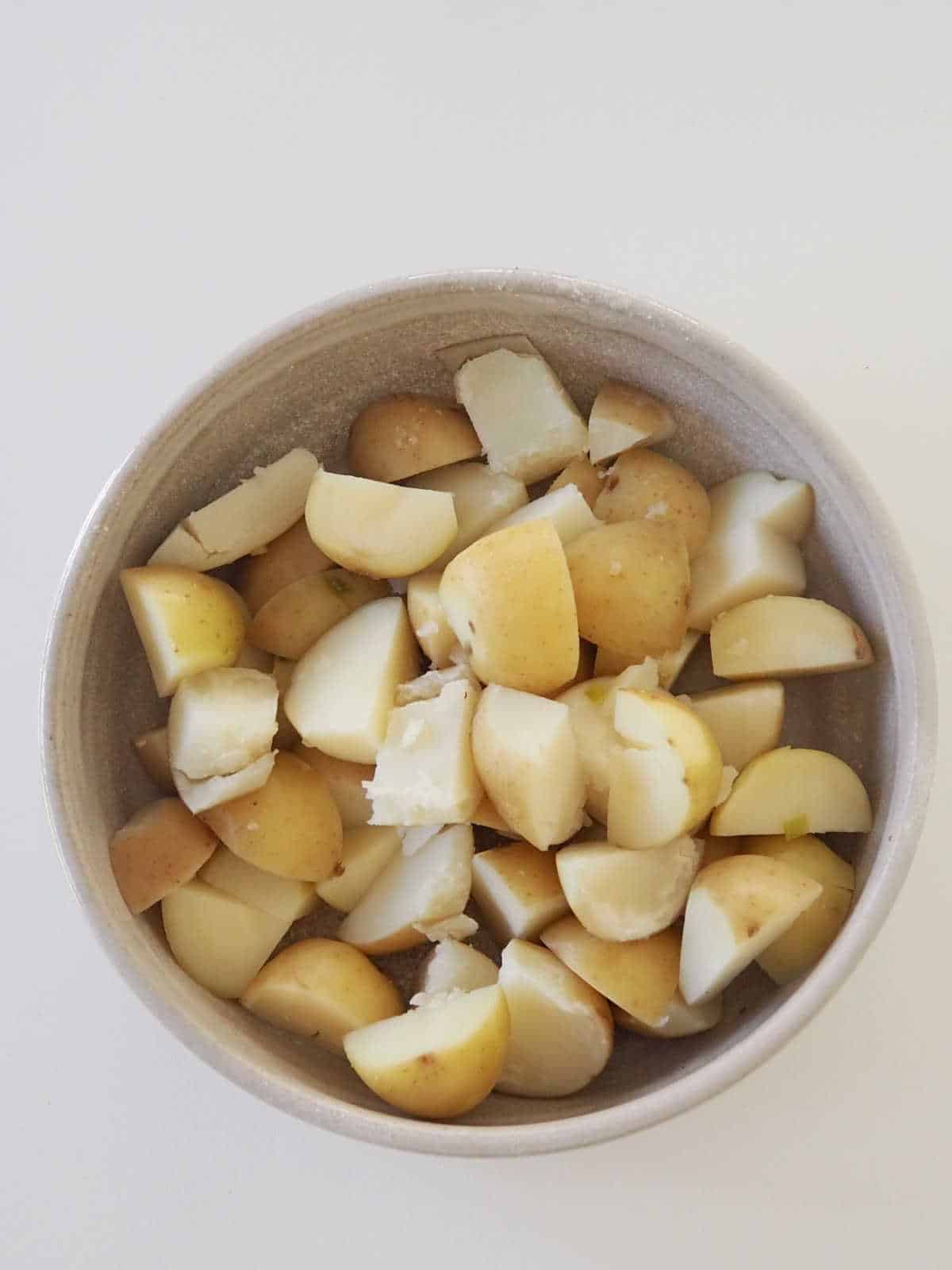 Cooked potatoes in bowl.