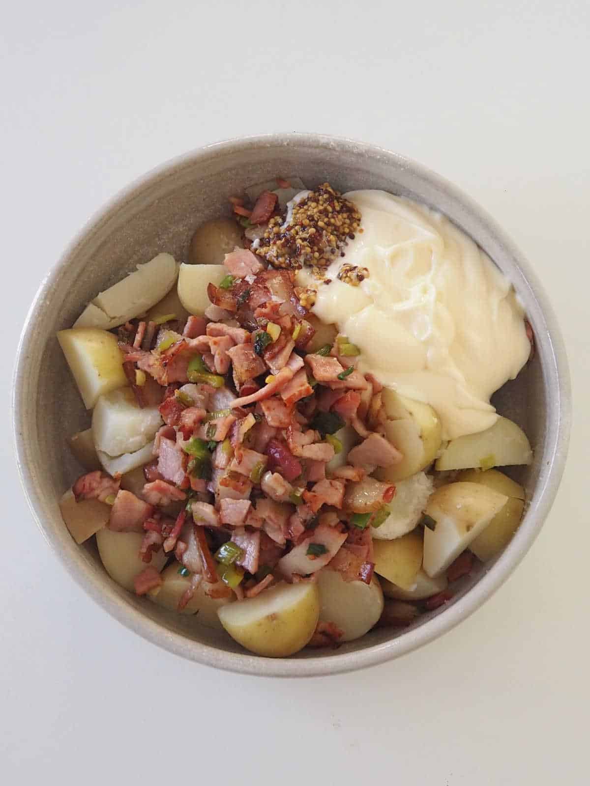 Potato Salad ingredients in serving bowl before being mixed together.