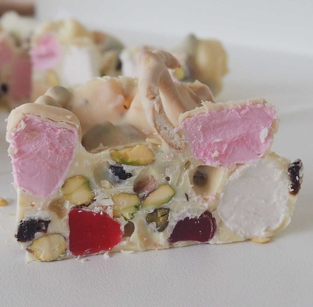 Side view of a slice of White Chocolate Rocky Road.