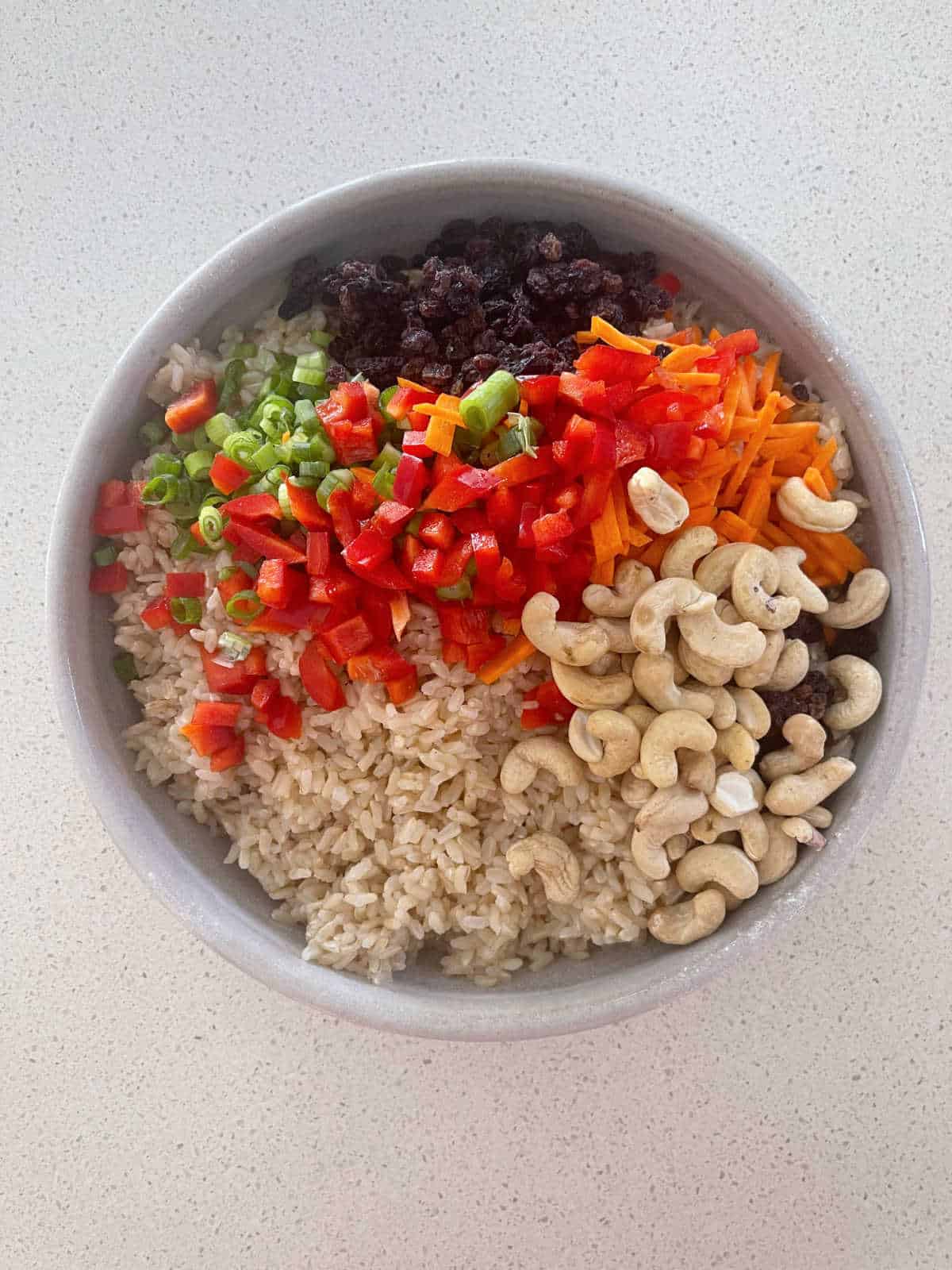 Brown Rice Salad ingredients in a bowl.