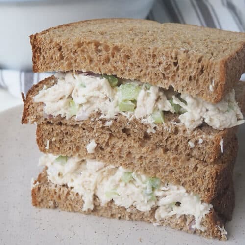Two wholemeal sandwiches with chicken sandwich filling.