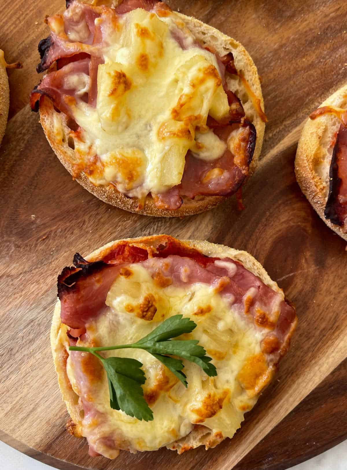 Hawaiian Pizza Muffin on a wooden serving board.