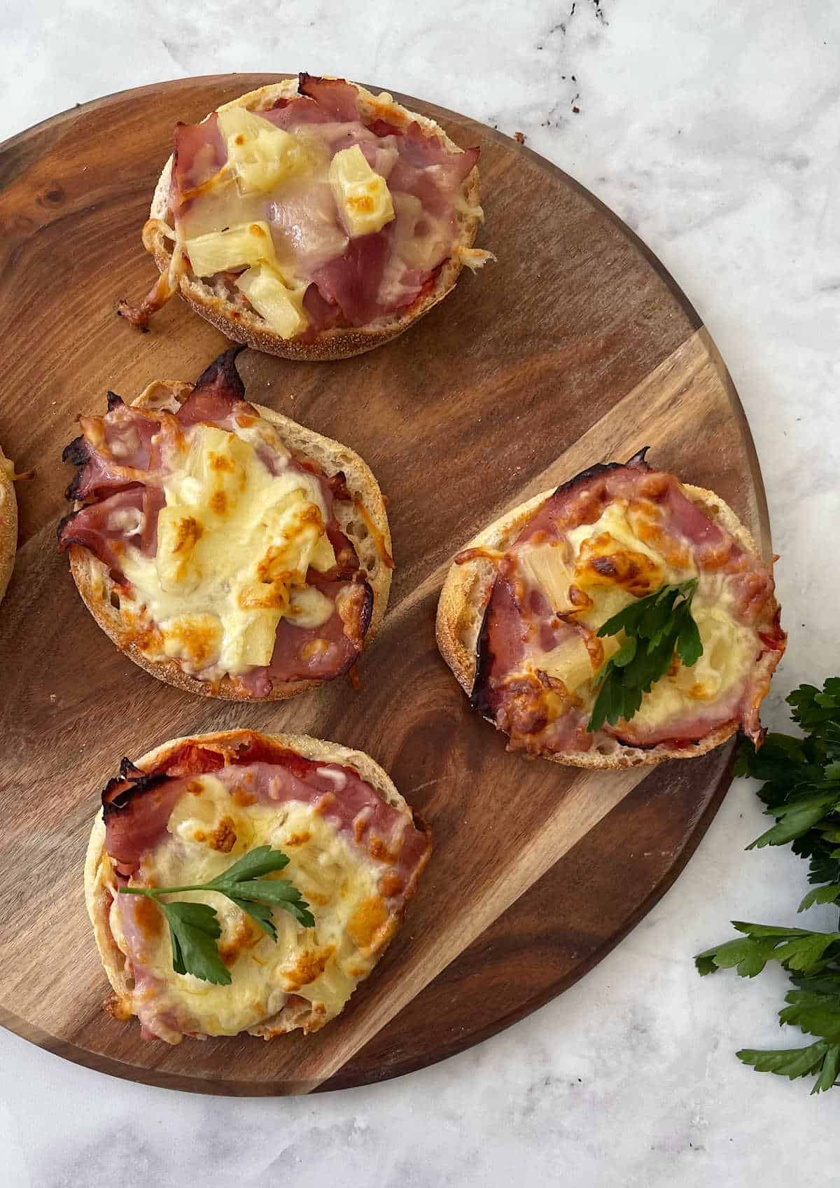 Hawaiian Pizza Muffin on a wooden serving board.