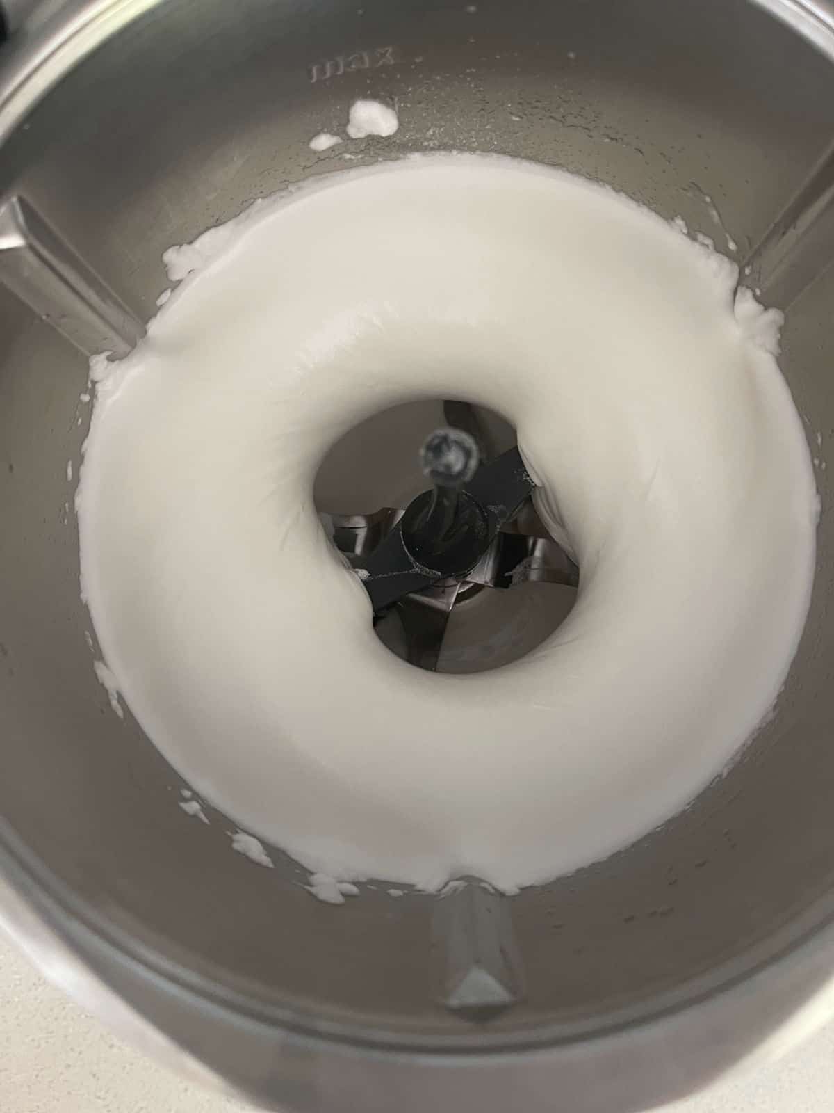 whipped egg whites in a Thermomix bowl.