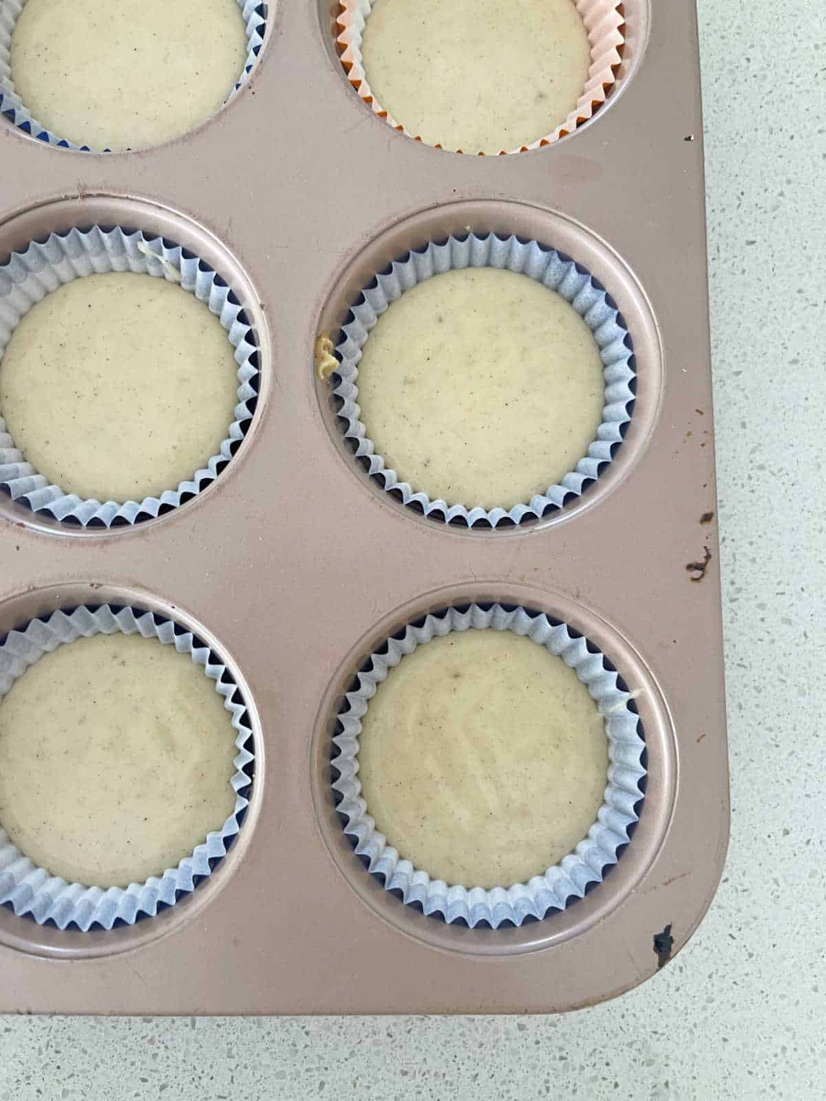 Banana muffin mixture in patty cases.