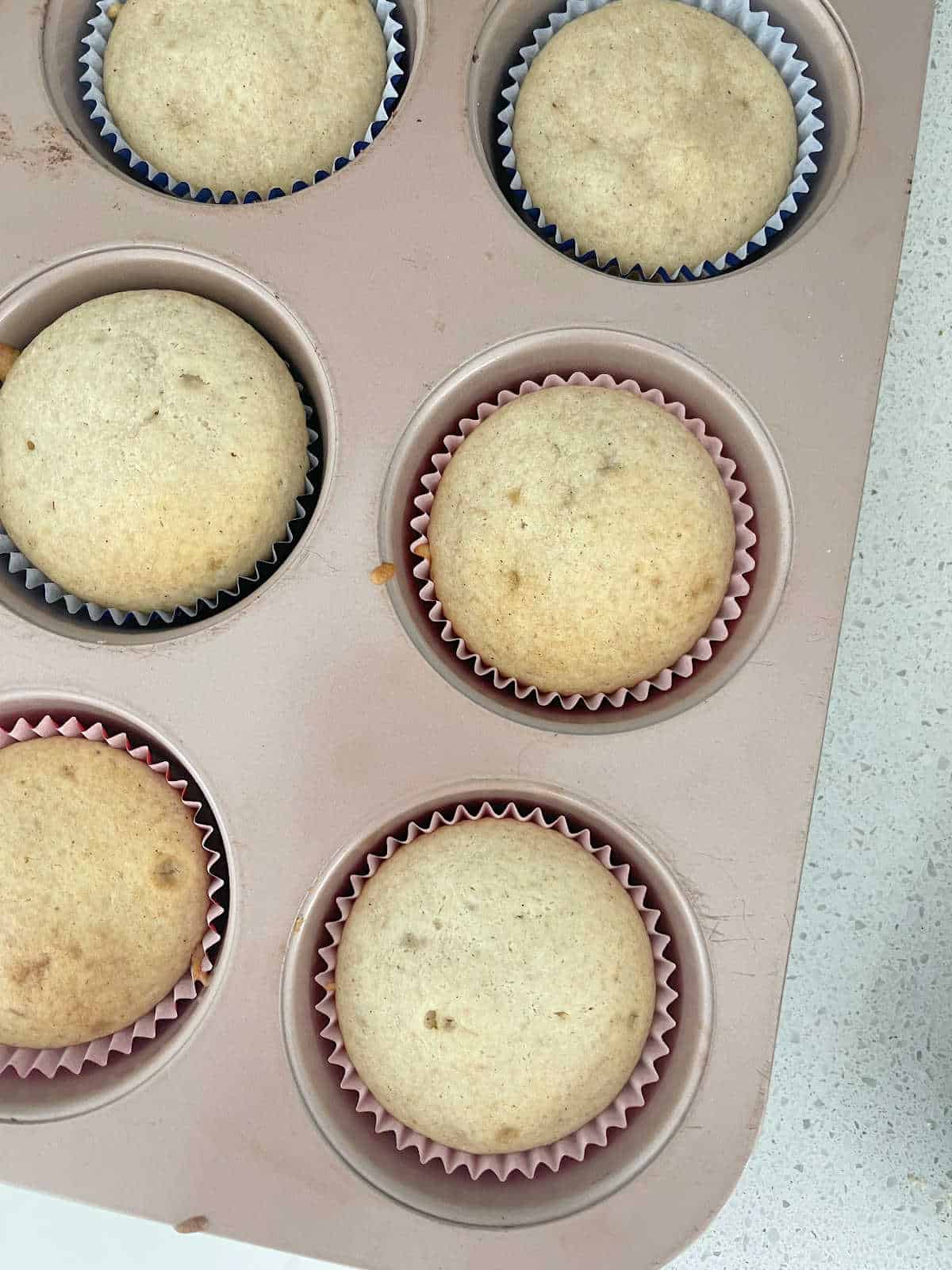 Cooked Banana Muffins in a muffin tray.