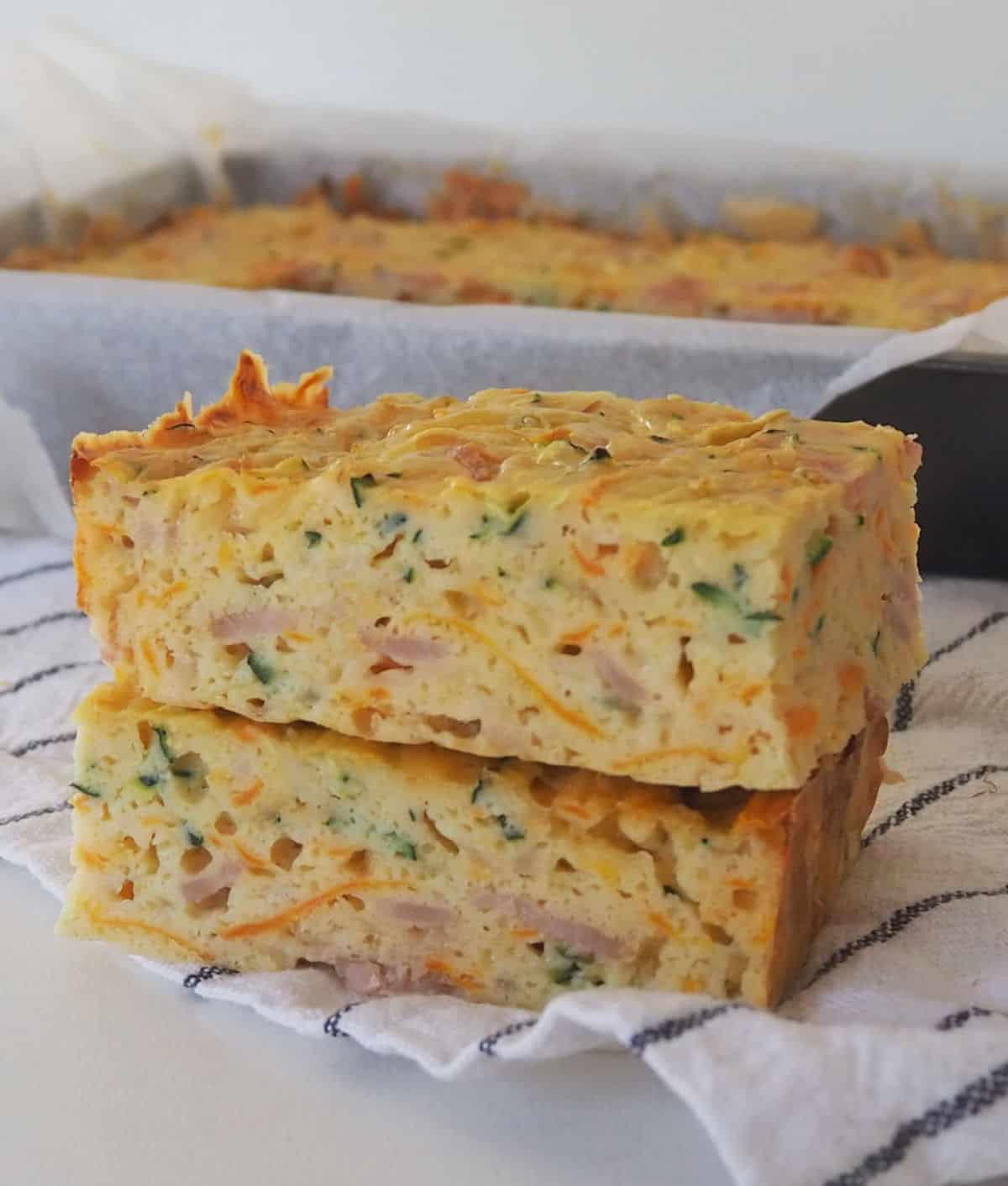 Two pieces of zucchini slice stacked on top of each other. 