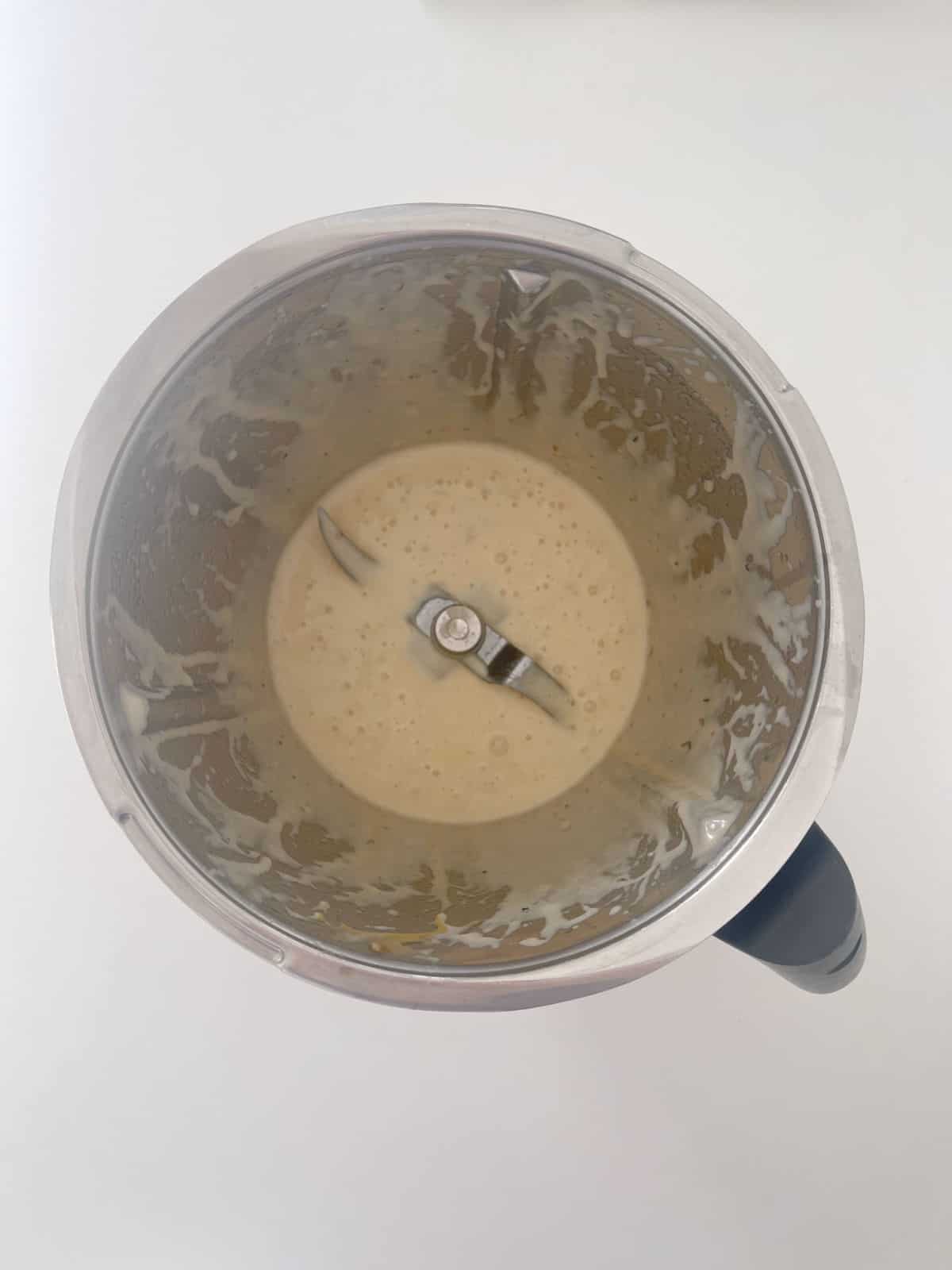 Coconut oil, eggs, banana and vanilla extract combined in a Thermomix bowl.