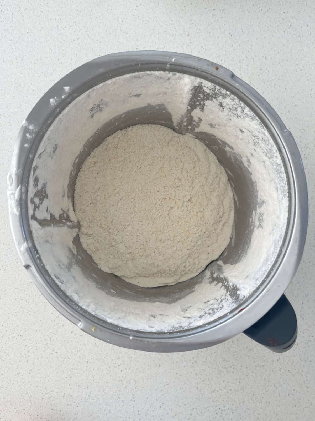 Self-raising flour combined with butter in a thermomix bowl.