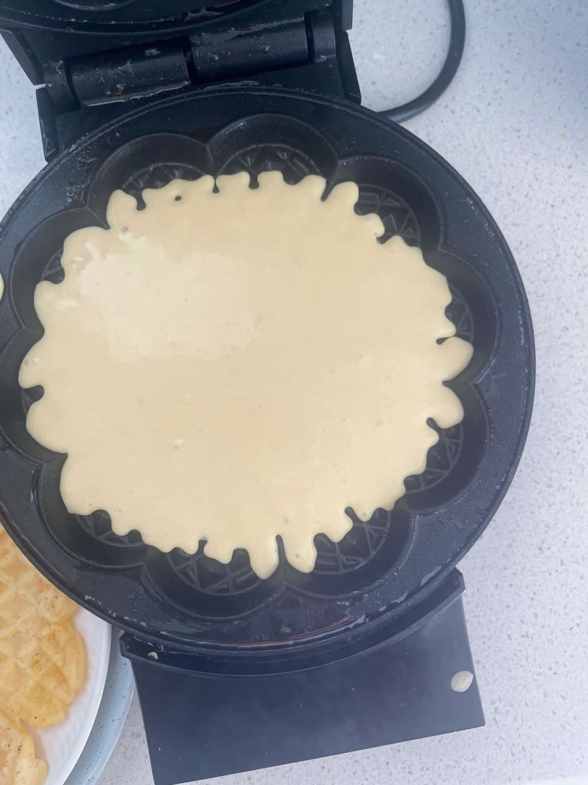 waffle batter in an waffle iron.