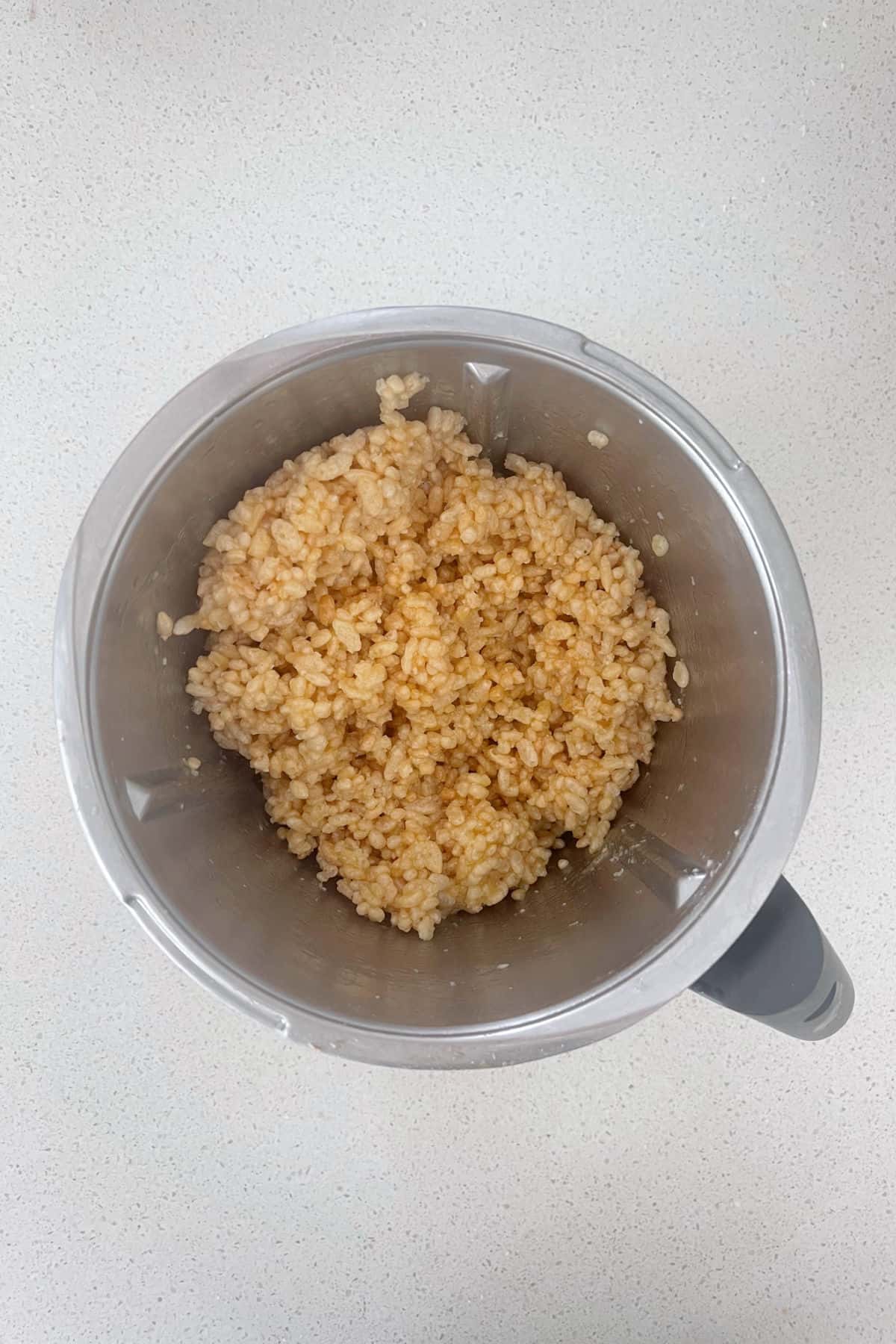 Ingredients to make Honey Rice Bubble slice combined in a Thermomix.