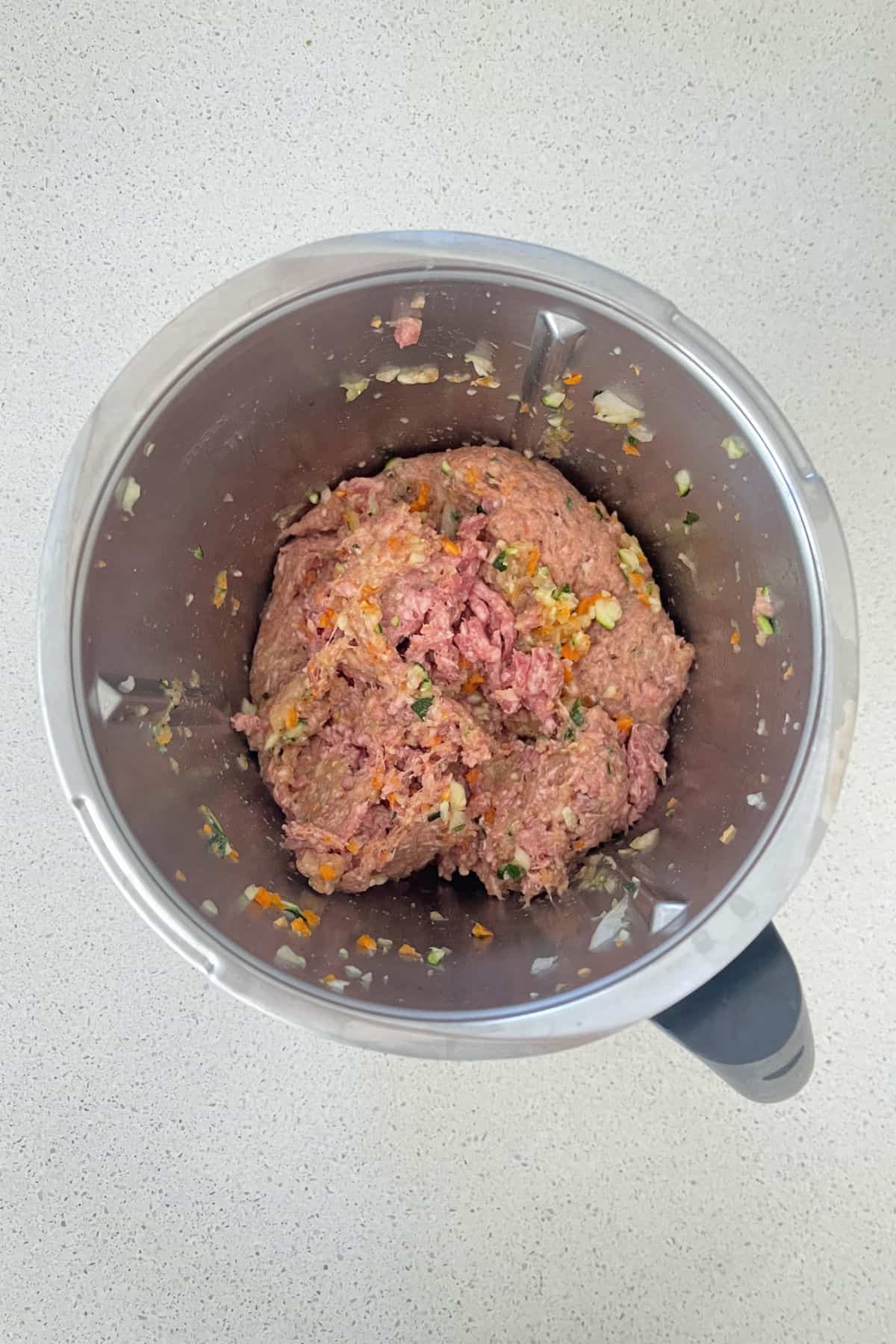 Beef Rissole Ingredients mixed together in a thermomix bowl.