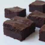Slices of Thermomix Brownies on a white bench.