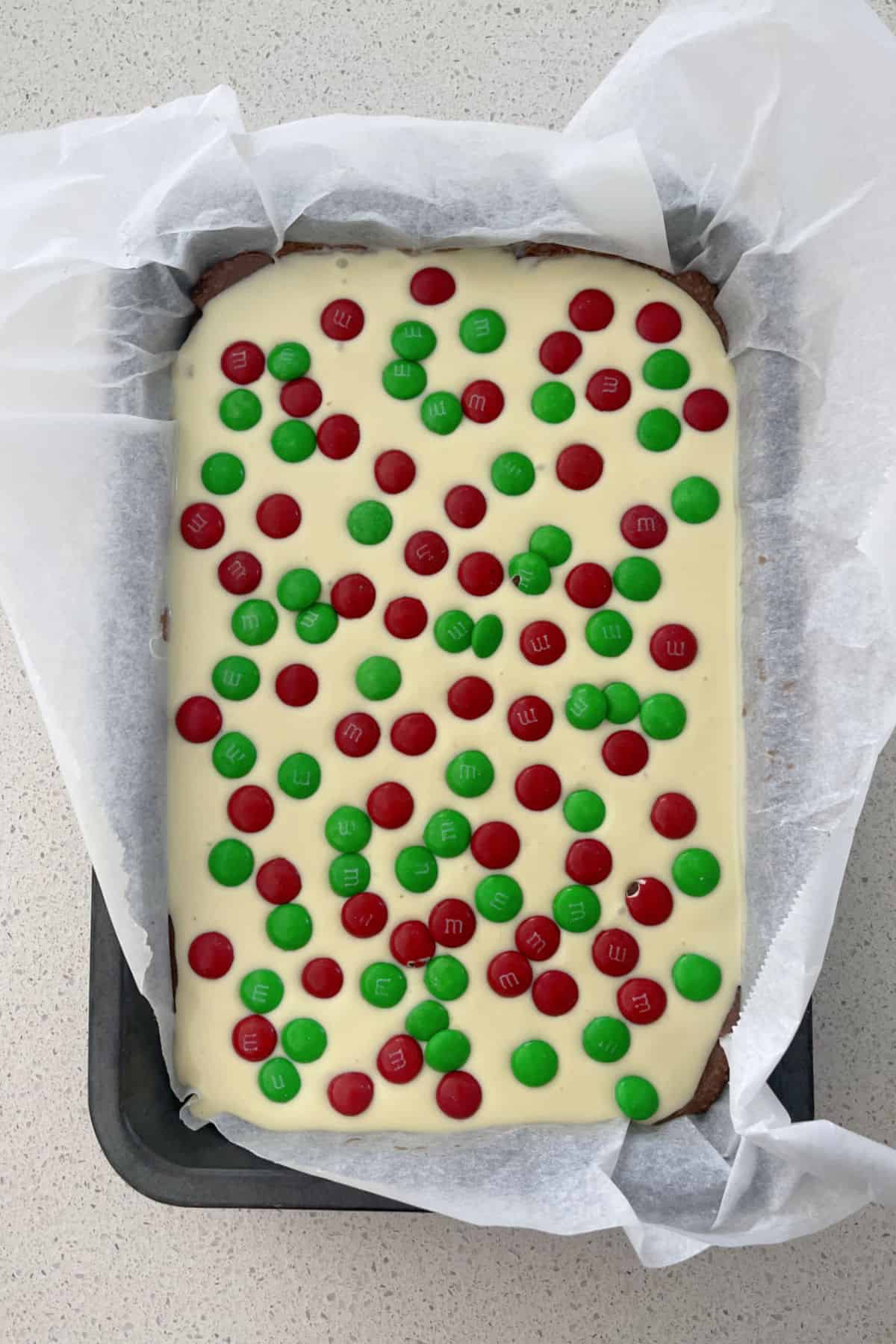 No Bake Christmas Slice in a baking tin ready to go into the fridge to set.
