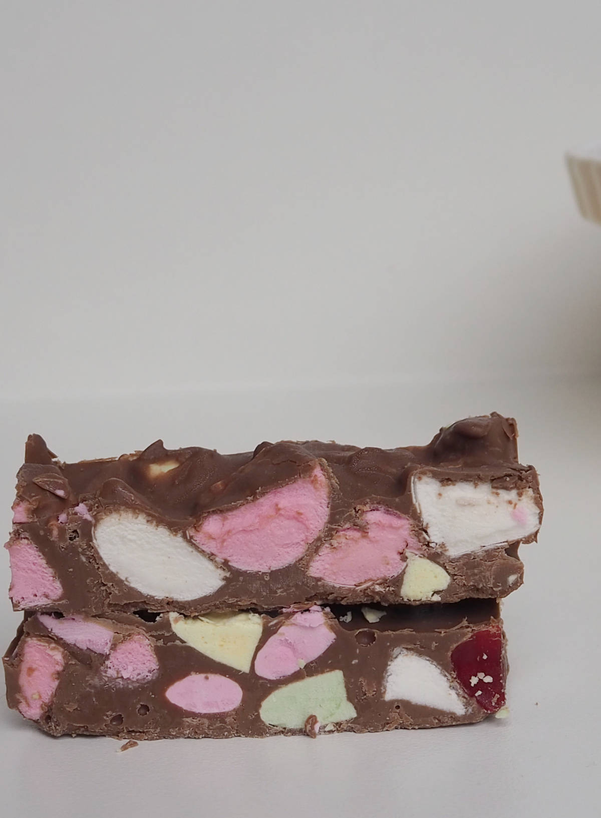 Two pieces of Clinkers Rocky Road stacked on top of each other.