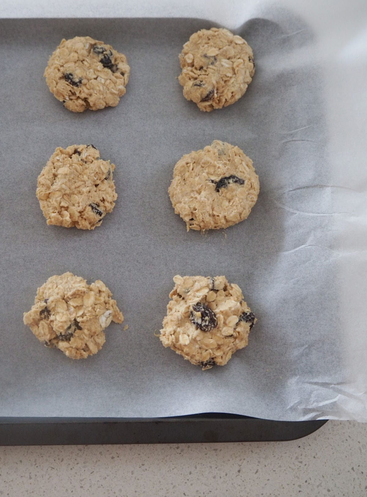 Oat and Raisin Cookie Dough on a baking tray.
