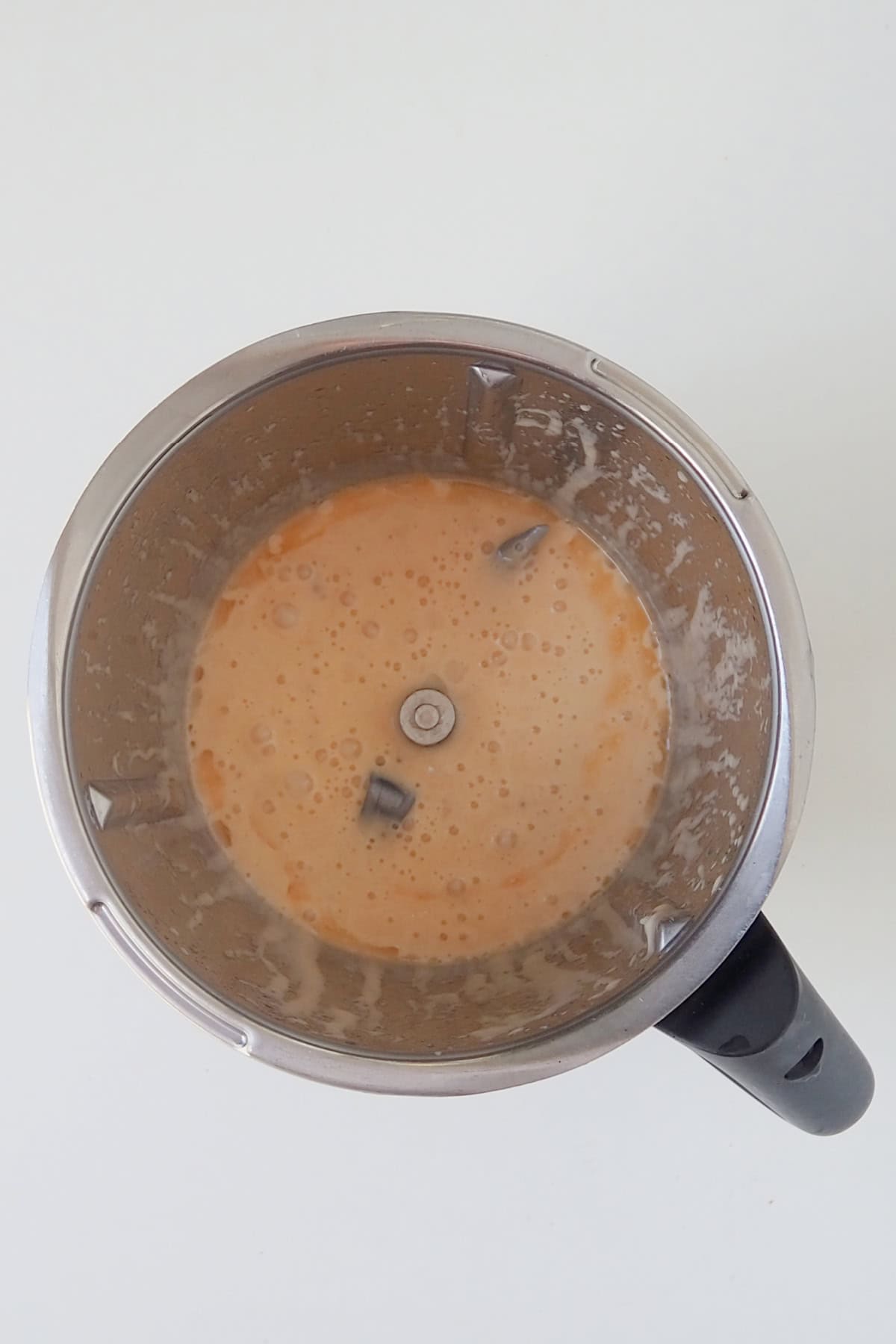 Combined coconut oil, mashed banana and pineapple in a thermomix bowl.