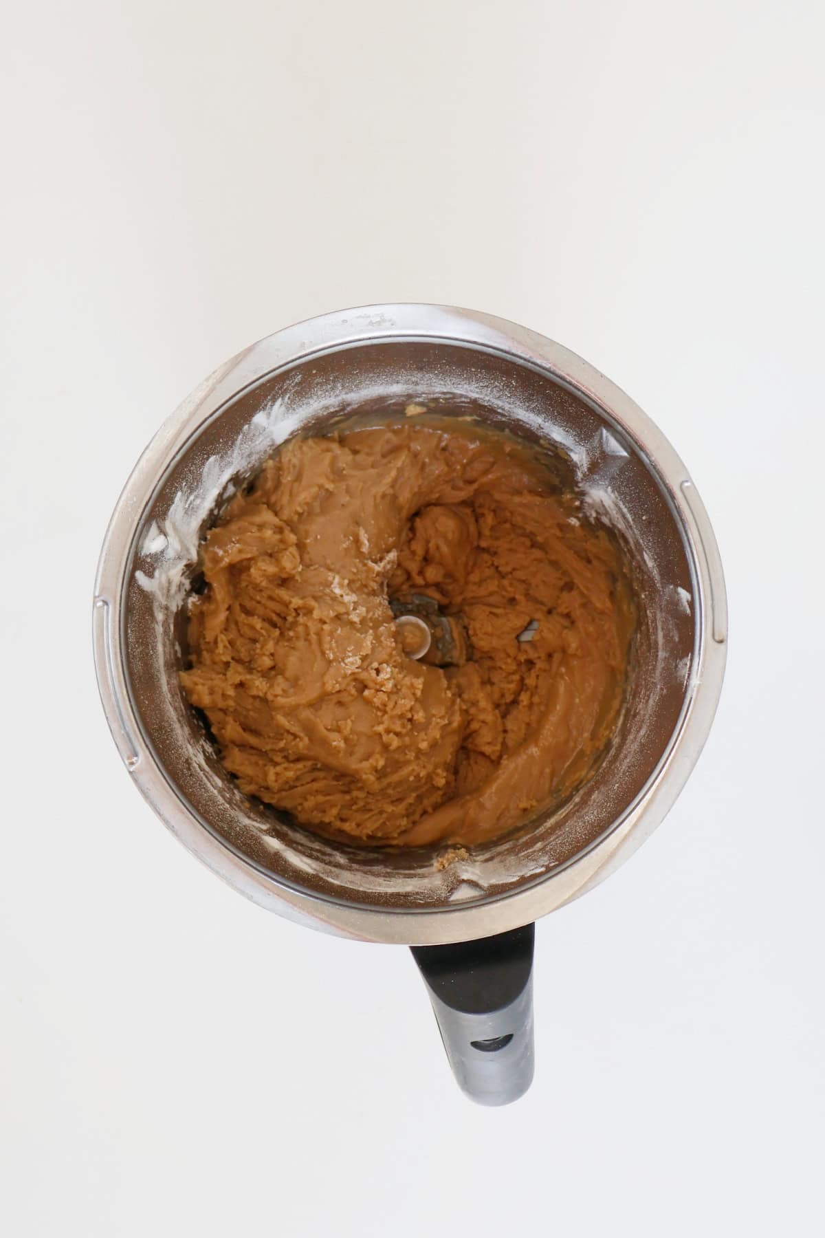 Caramel Biscuit mixture combined in a thermomix bowl.