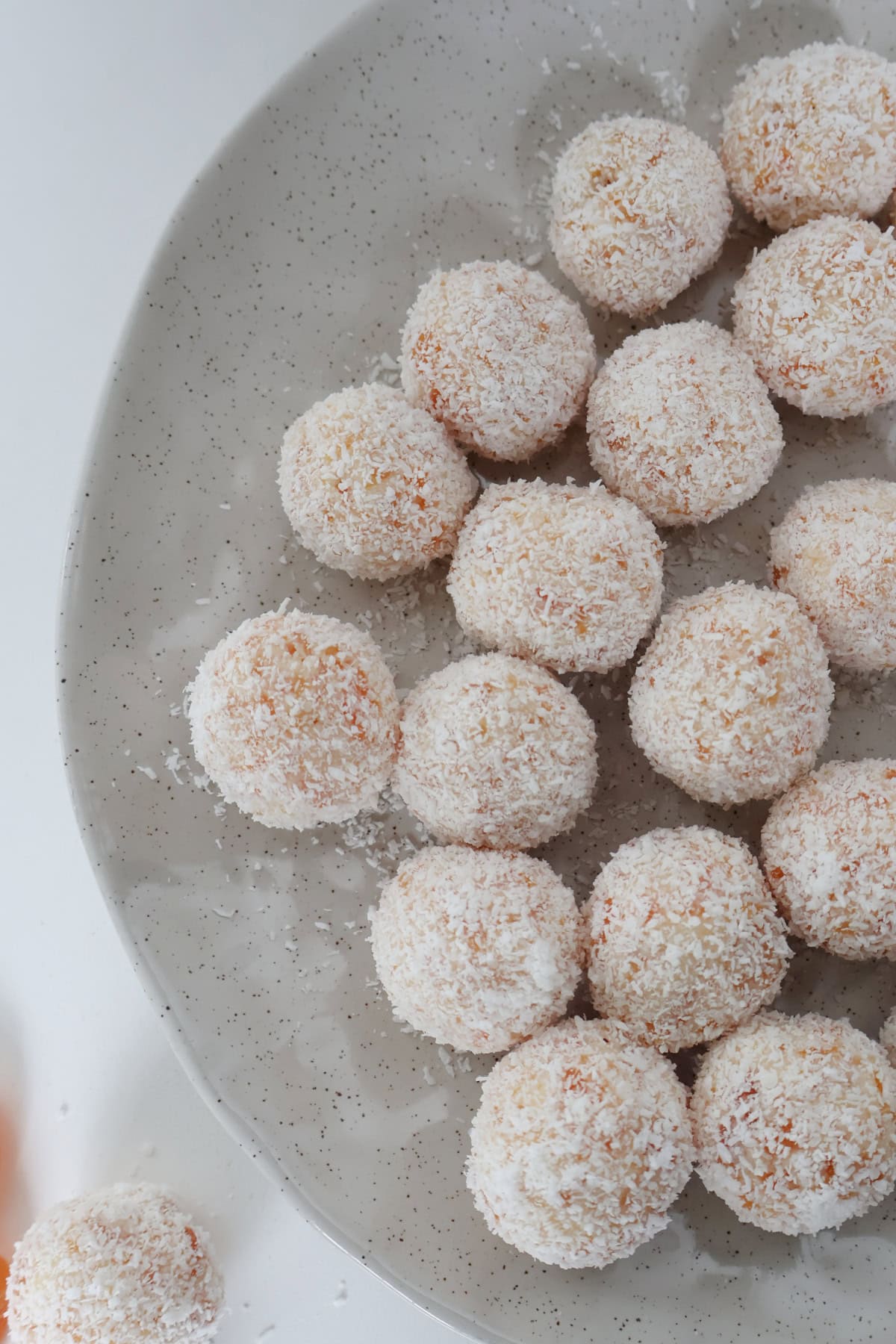 Close up overhead view of apricot and coconut balls.