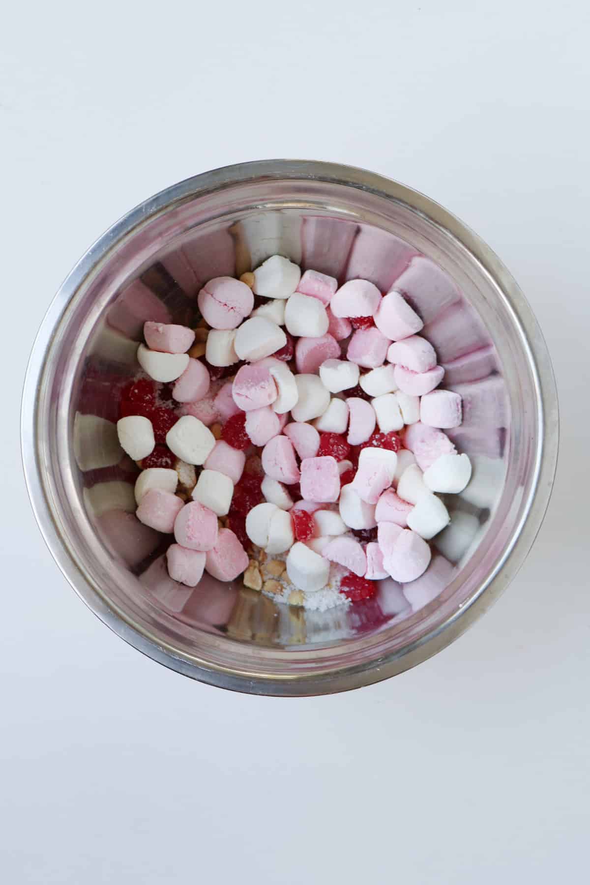 Rocky road ingredients in a silver bowl.