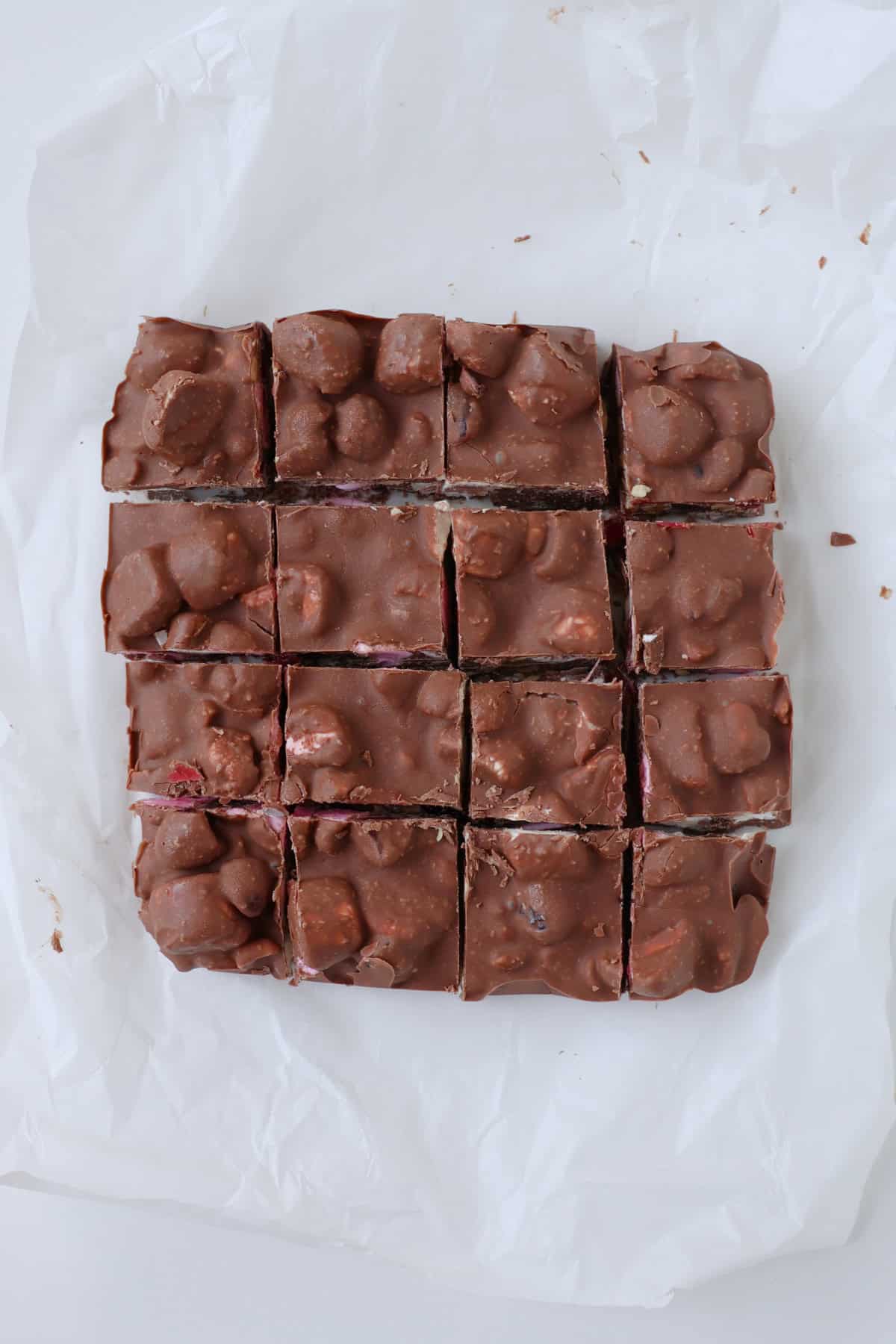 Slices of Rocky Road on a piece of baking paper.